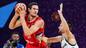 ISTANBUL, TURKEY - SEPTEMBER 17: Gasper Vidmar (14) of Slovenia in action against Boban Marjanovic (51) of Serbia during the FIBA Eurobasket 2017 final basketball match between Slovenia and Serbia at the Sinan Erdem Dome in Istanbul, Turkey on September 17, 2017. (Photo by Salih Zeki Fazlioglu/Anadolu Agency/Getty Images)