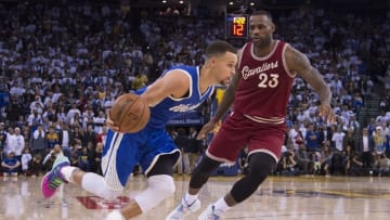 December 25, 2015; Oakland, CA, USA; Golden State Warriors guard Stephen Curry (30, left) dribbles the basketball against Cleveland Cavaliers forward LeBron James (23) in the fourth quarter of a NBA basketball game on Christmas at Oracle Arena. The Warriors defeated the Cavaliers 89-83. Mandatory Credit: Kyle Terada-USA TODAY Sports
