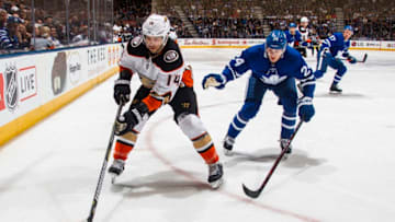 TORONTO, ON - FEBRUARY 05: Adam Henrique #14 of the Anaheim Ducks skates against Kasperi Kapanen #24 of the Toronto Maple Leafs during the first period at the Air Canada Centre on February 5, 2018 in Toronto, Ontario, Canada. (Photo by Mark Blinch/NHLI via Getty Images)