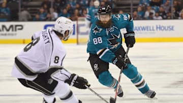 SAN JOSE, CA - APRIL 18: Brent Burns #88 of the San Jose Sharks controling the puck, looks to skate past Drew Doughty #8 of the Los Angeles Kings in the second period in Game Three of the Western Conference First Round during the 2016 NHL Stanley Cup Playoffs at SAP Center on April 18, 2016 in San Jose, California. (Photo by Thearon W. Henderson/Getty Images)