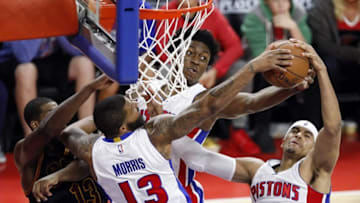 Apr 24, 2016; Auburn Hills, MI, USA; Detroit Pistons forward Marcus Morris (13), forward Stanley Johnson (3) and forward Tobias Harris (34) fight for a rebound during the fourth quarter against the Cleveland Cavaliers in game four of the first round of the NBA Playoffs at The Palace of Auburn Hills. Cavs win 100-98. Mandatory Credit: Raj Mehta-USA TODAY Sports