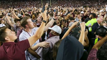 Texas A&M Aggies and fans rush the field after beating the Alabama Crimson Tide on a last second field in the fourth quarter at Kyle Field. Mandatory Credit: Thomas Shea-USA TODAY Sports