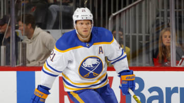 NEWARK, NEW JERSEY - OCTOBER 23: Kyle Okposo #21 of the Buffalo Sabres in action against the New Jersey Devils at Prudential Center on October 23, 2021 in Newark, New Jersey. The Devils defeated the Sabres 2-1 in overtime. (Photo by Jim McIsaac/Getty Images)