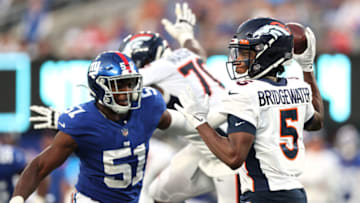EAST RUTHERFORD, NEW JERSEY - SEPTEMBER 12: Teddy Bridgewater #5 of the Denver Broncos looks to pass against Azeez Ojulari #51 of the New York Giants during the fourth quarter at MetLife Stadium on September 12, 2021 in East Rutherford, New Jersey. (Photo by Alex Trautwig/Getty Images)