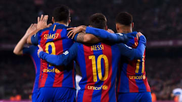 TOPSHOT - Barcelona's Uruguayan forward Luis Suarez (L) celebrates a goal with teammates Argentinian forward Lionel Messi (C) and Brazilian forward Neymar during the Spanish league football match FC Barcelona vs RCD Espanyol at the Camp Nou stadium in Barcelona on December 18, 2016. / AFP / JOSEP LAGO (Photo credit should read JOSEP LAGO/AFP/Getty Images)