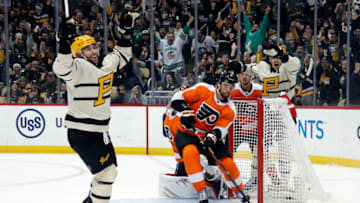 Mar 11, 2023; Pittsburgh, Pennsylvania, USA; Pittsburgh Penguins left wing Jason Zucker (left) reacts after scoring a goal against the Philadelphia Flyers during the third period at PPG Paints Arena. Pittsburgh won 5-1. Mandatory Credit: Charles LeClaire-USA TODAY Sports