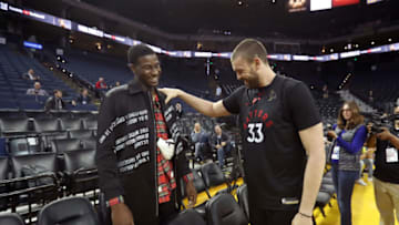 OAKLAND, CA - JUNE 6: Jaren Jackson Jr. #13 of the Memphis Grizzlies speaks to Marc Gasol #33 of the Toronto Raptors during practice as part of the 2019 NBA Finals on June 6, 2019 at ORACLE Arena in Oakland, California. NOTE TO USER: User expressly acknowledges and agrees that, by downloading and/or using this photograph, user is consenting to the terms and conditions of the Getty Images License Agreement. Mandatory Copyright Notice: Copyright 2019 NBAE (Photo by Joe Murphy/NBAE via Getty Images)