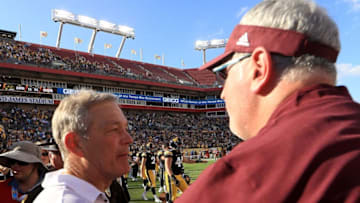 TAMPA, FL - JANUARY 01: Head coach Kirk Ferentz of the Iowa Hawkeyes and head coach Joe Moorhead of the Mississippi State Bulldogs shake hands following the 2019 Outback Bowl at Raymond James Stadium on January 1, 2019 in Tampa, Florida. (Photo by Mike Ehrmann/Getty Images)