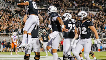 Sep 2, 2021; Orlando, Florida, USA; UCF Knights wide receiver Titus Mokiao-Atimalala (0) is lifted into the air by teammates after scoring a touchdown against the Boise State Broncos during the second quarter at Bounce House. Mandatory Credit: Mike Watters-USA TODAY Sports