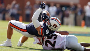 Auburn footballOct 9, 2021; Auburn, Alabama, USA; Auburn Tigers tight end Luke Deal (86) rolls over Georgia Bulldogs defensive back Christopher Smith (29) during the first quarter at Jordan-Hare Stadium. Mandatory Credit: John Reed-USA TODAY Sports