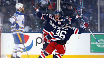 NEW YORK, NY - JANUARY 01: J.T. Miller #10 of the New York Rangers celebrates his game-winning goal in overtime against the Buffalo Sabres with teammate Mats Zuccarello #36 during the 2018 Bridgestone NHL Winter Classic at Citi Field on January 1, 2018 in the Flushing neighborhood of the Queens borough of New York City. (Photo by Bruce Bennett/Getty Images)