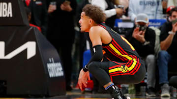 ATLANTA, GA - DECEMBER 10: Trae Young #11 of the Atlanta Hawks reacts during the first half against the Brooklyn Nets at State Farm Arena on December 10, 2021 in Atlanta, Georgia. NOTE TO USER: User expressly acknowledges and agrees that, by downloading and or using this photograph, User is consenting to the terms and conditions of the Getty Images License Agreement. (Photo by Todd Kirkland/Getty Images)