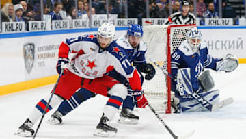 MOSCOW, RUSSIA - JANUARY 08: Konstantin Okulov #71 of the CSKA Moscow battles for the puck against Kirill Lyamin #2 of the Dynamo Moscow during the first period at the Arena VTB Moscow on January 8, 2020 in Moscow, Russia. (Photo by Anna Sergeeva/ Getty Images)