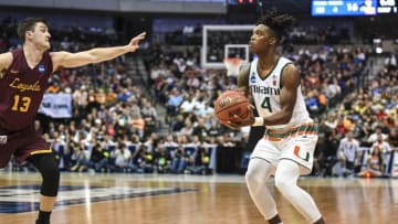 DALLAS, TX - MARCH 15: Lonnie Walker IV #4 of the Miami (Fl) Hurricanes gets ready to shoot the ball over Clayton Custer #13 of the Loyola (Il) Ramblers during the first round of the 2018 NCAA Men's Basketball Tournament held at the American Airlines Center on March 15, 2018 in Dallas, Texas. Loyola defeats Miami 64-62. (Photo by Andy Hancock/NCAA Photos via Getty Images)