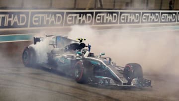 ABU DHABI, UNITED ARAB EMIRATES - NOVEMBER 26: Race winner Valtteri Bottas driving the (77) Mercedes AMG Petronas F1 Team Mercedes F1 WO8 celebrates with donuts on track during the Abu Dhabi Formula One Grand Prix at Yas Marina Circuit on November 26, 2017 in Abu Dhabi, United Arab Emirates. (Photo by Mark Thompson/Getty Images)