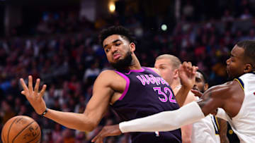 DENVER, CO - MARCH 12: Karl-Anthony Towns #32 of the Minnesota Timberwolves and Paul Millsap #4 of the Denver Nuggets. (Photo by Jamie Schwaberow/Getty Images)