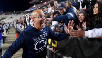 COLLEGE PARK, MARYLAND - NOVEMBER 06: Head coach James Franklin of the Penn State Nittany Lions celebrates with fans after a 31-14 victory against the Maryland Terrapins at Capital One Field at Maryland Stadium on November 06, 2021 in College Park, Maryland. (Photo by G Fiume/Getty Images)