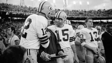 Jan. 14, 1968; Miami, FL, USA; FILE PHOTO; Green Bay Packers quarterbacks Zeke Bratkowski (12) and Bart Starr (15) celebrate near the end of Super Bowl II against the Oakland Raiders at the Orange Bowl. The Packers defeated the Raiders 33-14. Mandatory Credit: Press-Gazette/USA TODAY Sports