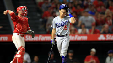 ANAHEIM, CALIFORNIA - JUNE 11: Enrique Hernandez #14 of the Los Angeles Dodgers reacts to striking out as Jonathan Lucroy #20 of the Los Angeles Angels of Anaheim looks on during the ninth inning of a game at Angel Stadium of Anaheim on June 11, 2019 in Anaheim, California. (Photo by Sean M. Haffey/Getty Images)