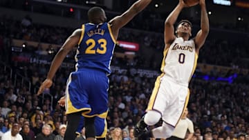 Mar 6, 2016; Los Angeles, CA, USA; Los Angeles Lakers forward Nick Young (0) shoots against Golden State Warriors forward Draymond Green (23) during the NBA game at the Staples Center. Mandatory Credit: Richard Mackson-USA TODAY Sports