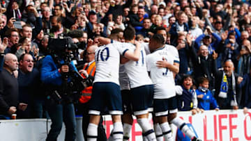 LONDON, UNITED KINGDOM - APRIL 10: Dele Alli of Tottenham Hotspur (obscured) celebrates with team mates as he scores their first goal during the Barclays Premier League match between Tottenham Hotspur and Manchester United at White Hart Lane on April 10, 2016 in London, England. (Photo by Julian Finney/Getty Images)