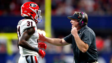 ATLANTA, GEORGIA - DECEMBER 04: Head Coach Kirby Smart of the Georgia Bulldogs talks to William Poole #31 of the Georgia Bulldogs in the second quarter of the SEC Championship game against the aAlabama Crimson Tide at Mercedes-Benz Stadium on December 04, 2021 in Atlanta, Georgia. (Photo by Todd Kirkland/Getty Images)