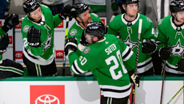 Apr 9, 2022; Dallas, Texas, USA; Dallas Stars left wing Jason Robertson (21) and center Luke Glendening (11) and defenseman Ryan Suter (20) after defenseman Miro Heiskanen (4) scores a power play goal against the New Jersey Devils during the second period at the at American Airlines Center. Mandatory Credit: Jerome Miron-USA TODAY Sports