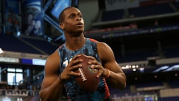 Feb 24, 2013; Indianapolis, IN, USA; West Virginia quarterback Geno Smith (13) participates in a passing drill during the NFL Combine at Lucas Oil Stadium. Mandatory Credit: Brian Spurlock-USA TODAY Sports