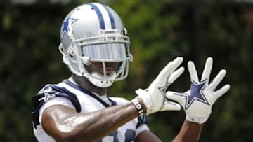 Jun 17, 2014; Dallas, TX, USA; Dallas Cowboys receiver Dez Bryant (88) catches footballs for a drill during minicamp at Cowboys headquarters at Valley Ranch. Mandatory Credit: Matthew Emmons-USA TODAY Sports