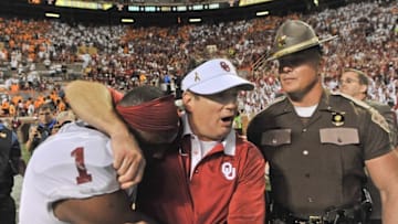Sep 12, 2015; Knoxville, TN, USA; Oklahoma Sooners head coach Bob Stoops celebrates with wide receiver Jarvis Baxter (1) after defeating the Tennessee Volunteers in double overtime at Neyland Stadium. Oklahoma won 31-24. Mandatory Credit: Jim Brown-USA TODAY Sports