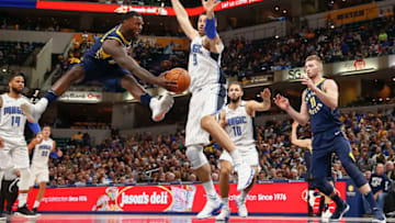 INDIANAPOLIS, IN - NOVEMBER 27: Lance Stephenson #1 of the Indiana Pacers passes the ball off as Nikola Vucevic #9 of the Orlando Magic defends at Bankers Life Fieldhouse on November 27, 2017 in Indianapolis, Indiana. NOTE TO USER: User expressly acknowledges and agrees that, by downloading and or using this photograph, User is consenting to the terms and conditions of the Getty Images License Agreement.(Photo by Michael Hickey/Getty Images)