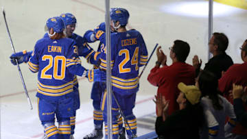 BUFFALO, NEW YORK - OCTOBER 16: Buffalo Sabres players celebrate a goal by Cody Eakin #20 during the second period of a NHL hockey game against the Arizona Coyotes at KeyBank Center on October 16, 2021 in Buffalo, New York. (Photo by Joshua Bessex/Getty Images)