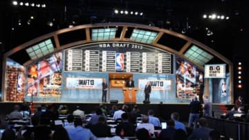 Jun 27, 2013; Brooklyn, NY, USA; A general view as NBA commissioner David Stern (right) , deputy commissioner Adam Silver (left) and former NBA player Hakeem Olajuwon speak on stage after the first round of the 2013 NBA Draft at the Barclays Center. Mandatory Credit: Joe Camporeale-USA TODAY Sports