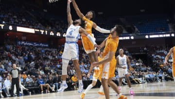 Nov 21, 2021; Uncasville, CT, USA; Tennessee Volunteers guard Kennedy Chandler (1) blocks a shot attempt by North Carolina Tarheels guard RJ Davis (4) during the first half at Mohegan Sun Arena. Mandatory Credit: Gregory Fisher-USA TODAY Sports