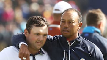 PARIS, FRANCE - SEPTEMBER 29: Tiger Woods of the United States consolls Patrick Reed of the United States following defeat during the morning fourball matches of the 2018 Ryder Cup at Le Golf National on September 29, 2018 in Paris, France. (Photo by Jamie Squire/Getty Images)