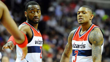 May 15, 2015; Washington, DC, USA; Washington Wizards guard John Wall (2) and guard Bradley Beal (3) react against the Atlanta Hawks during the second half in game six of the second round of the NBA Playoffs at Verizon Center. Mandatory Credit: Brad Mills-USA TODAY Sports
