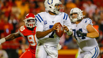 KANSAS CITY, MO - OCTOBER 06: Jacoby Brissett #7 of the Indianapolis Colts rolls out of the pocket during the third quarter with pressure from Emmanuel Ogbah #90 of the Kansas City Chiefs at Arrowhead Stadium on October 6, 2019 in Kansas City, Missouri. (Photo by David Eulitt/Getty Images)