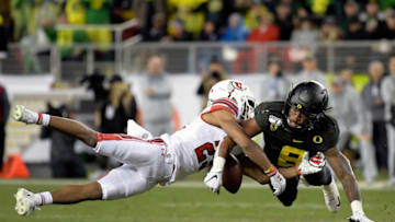 Dec 6, 2019; Santa Clara, CA, USA; Oregon Ducks safety Jevon Holland (8) breaks up a pass intended for Utah Utes wide receiver Jaylen Dixon (25) during the first half of the Pac-12 Conference championship game at Levi's Stadium. Mandatory Credit: Kirby Lee-USA TODAY Sports