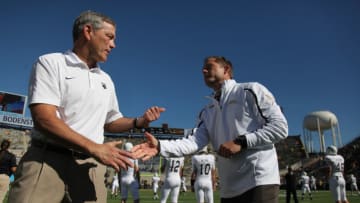 IOWA CITY, IOWA- SEPTEMBER 21: Head coach Kirk Ferentz of the Iowa Hawkeyes visits with head coach P.J. Fleck of the Western Michigan Broncos before their match-up on September 21, 2013 at Kinnick Stadium in Iowa City, Iowa. (Photo by Matthew Holst/Getty Images)