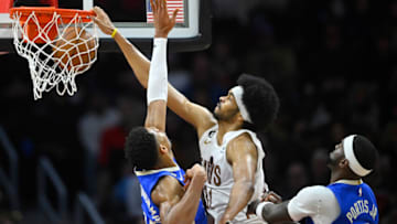 Dec 21, 2022; Cleveland, Ohio, USA; Cleveland Cavaliers center Jarrett Allen (31) dunks between Milwaukee Bucks forward Giannis Antetokounmpo (34) and forward Bobby Portis (9) in the third quarter at Rocket Mortgage FieldHouse. Mandatory Credit: David Richard-USA TODAY Sports