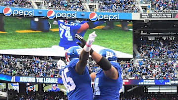 Nov 20, 2016; East Rutherford, NJ, USA; New York Giants tight end Will Tye (45) celebrates scoring a touchdown in the second half with teammate Ereck Flowers (74) at MetLife Stadium. Mandatory Credit: Robert Deutsch-USA TODAY Sports