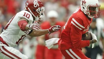 Sep 3, 2016; Houston, TX, USA; Houston Cougars wide receiver Isaiah Johnson (14) runs past Oklahoma Sooners safety Steven Parker (10) in the second quarter at NRG Stadium. Mandatory Credit: Thomas B. Shea-USA TODAY Sports