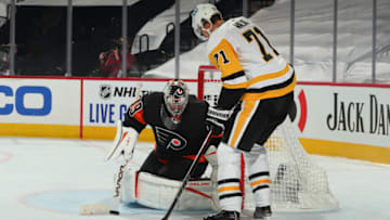 PHILADELPHIA, PA - JANUARY 15: Carter Hart #79 of the Philadelphia Flyers makes a save in front of Evgeni Malkin #71 of the Pittsburgh Penguins in the second period at the Wells Fargo Center on January 15, 2021 in Philadelphia, Pennsylvania. (Photo by Mitchell Leff/Getty Images)