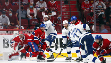 Victor Hedman #77 of the Tampa Bay Lightning takes the shot as Anthony Cirelli #71 looks to avoid the shot against Carey Price #31 of the Montreal Canadiens during Game Four of the 2021 NHL Stanley Cup Final at the Bell Centre on July 05, 2021 in Montreal, Quebec, Canada. (Photo by Bruce Bennett/Getty Images)