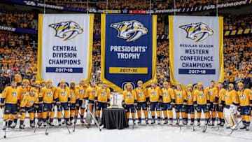 NASHVILLE, TN - OCTOBER 9: The Nashville Predators pose with the Presidents' Trophy during the banner raising ceremony prior to an NHL game against the Calgary Flames at Bridgestone Arena on October 9, 2018 in Nashville, Tennessee. (Photo by John Russell/NHLI via Getty Images)