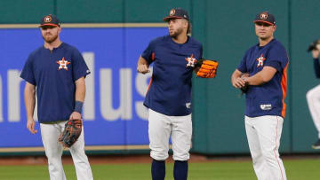 HOUSTON, TX - AUGUST 18: Springer, Fisher, and Davis of the Houston Astros (Photo by Bob Levey/Getty Images)