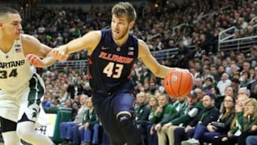 Jan 7, 2016; East Lansing, MI, USA; Illinois Fighting Illini forward Michael Finke (43) drives to the basket against Michigan State Spartans forward Gavin Schilling (34) during the 1st half of a game at Jack Breslin Student Events Center. Mandatory Credit: Mike Carter-USA TODAY Sports