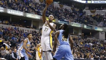 Jan 30, 2016; Indianapolis, IN, USA; Indiana Pacers center Jordan Hill (27) takes a shot against Denver Nuggets forward Kenneth Faried (35) at Bankers Life Fieldhouse. Mandatory Credit: Brian Spurlock-USA TODAY Sports