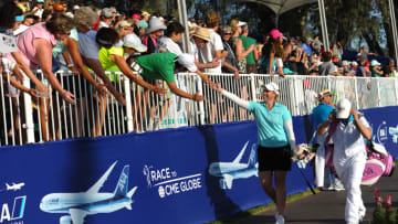 RANCHO MIRAGE, CA - APRIL 05: Brittany Lincicome gives high fives to the crowd on her way to the 18th green the ANA Inspiration on the Dinah Shore Tournament Course at Mission Hills Country Club on April 5, 2015 in Rancho Mirage, California. (Photo by Robert Laberge/Getty Images)