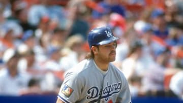 NEW YORK - CIRCA 1994: Mike Piazza #31 of the Los Angeles Dodgers bats against the New York Mets during a Major League Baseball game circa 1994 at Shea Stadium in the Queens borough of New York City. Piazza played for the Dodgers in 1991-98. (Photo by Focus on Sport/Getty Images)